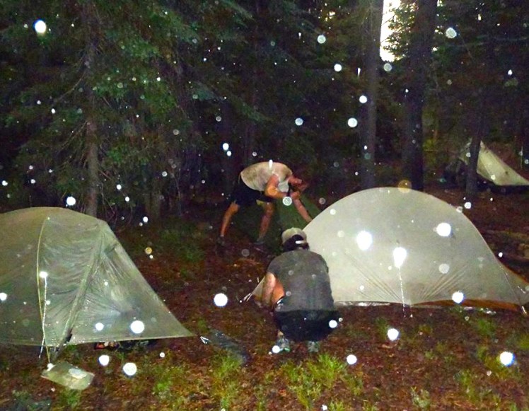 Setting up our wet tents during a downpour in Oregon last summer